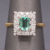 Vintage Emerald Cut Emerald and Diamond Halo Engagement Ring in 18k Yellow Gold