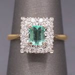 Vintage Emerald Cut Emerald and Diamond Halo Engagement Ring in 18k Yellow Gold