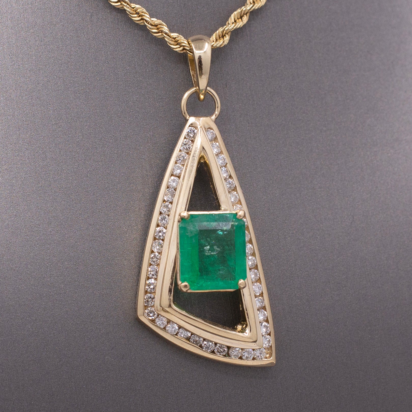 Modernist Natural Emerald and Channel Set Diamond Pendant in 14k Yellow Gold
