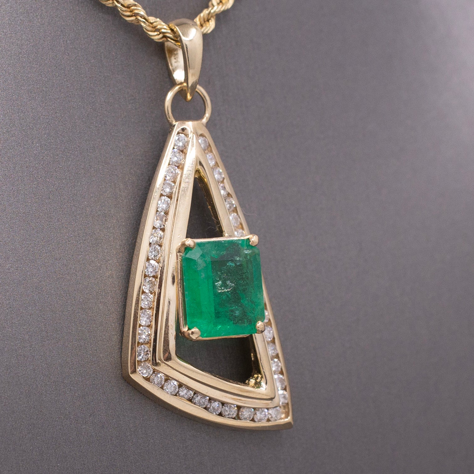 Modernist Natural Emerald and Channel Set Diamond Pendant in 14k Yellow Gold
