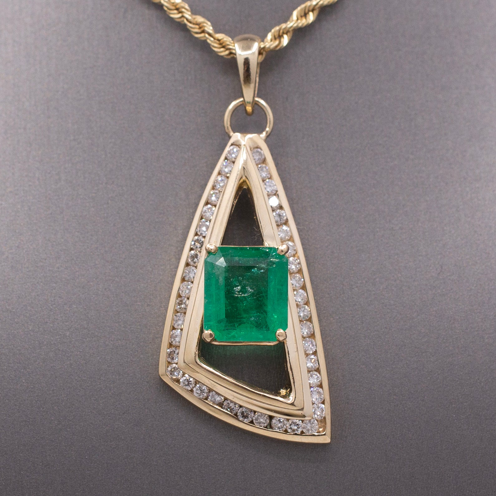 Modernist Natural Emerald and Channel Set Diamond Pendant in 14k Yellow Gold