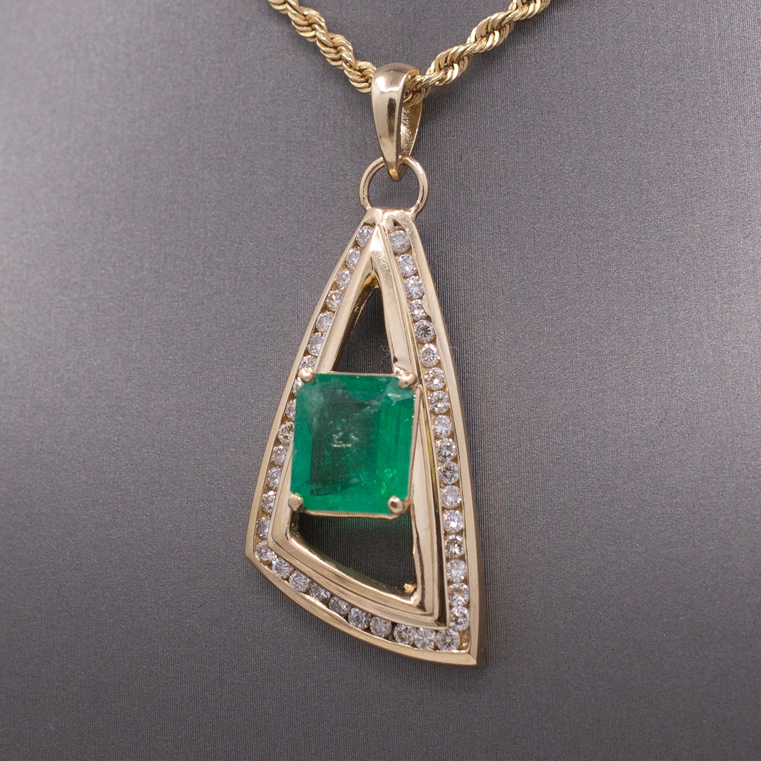 Modernist Natural Emerald and Channel Set Diamond Pendant in 14k Yellow Gold