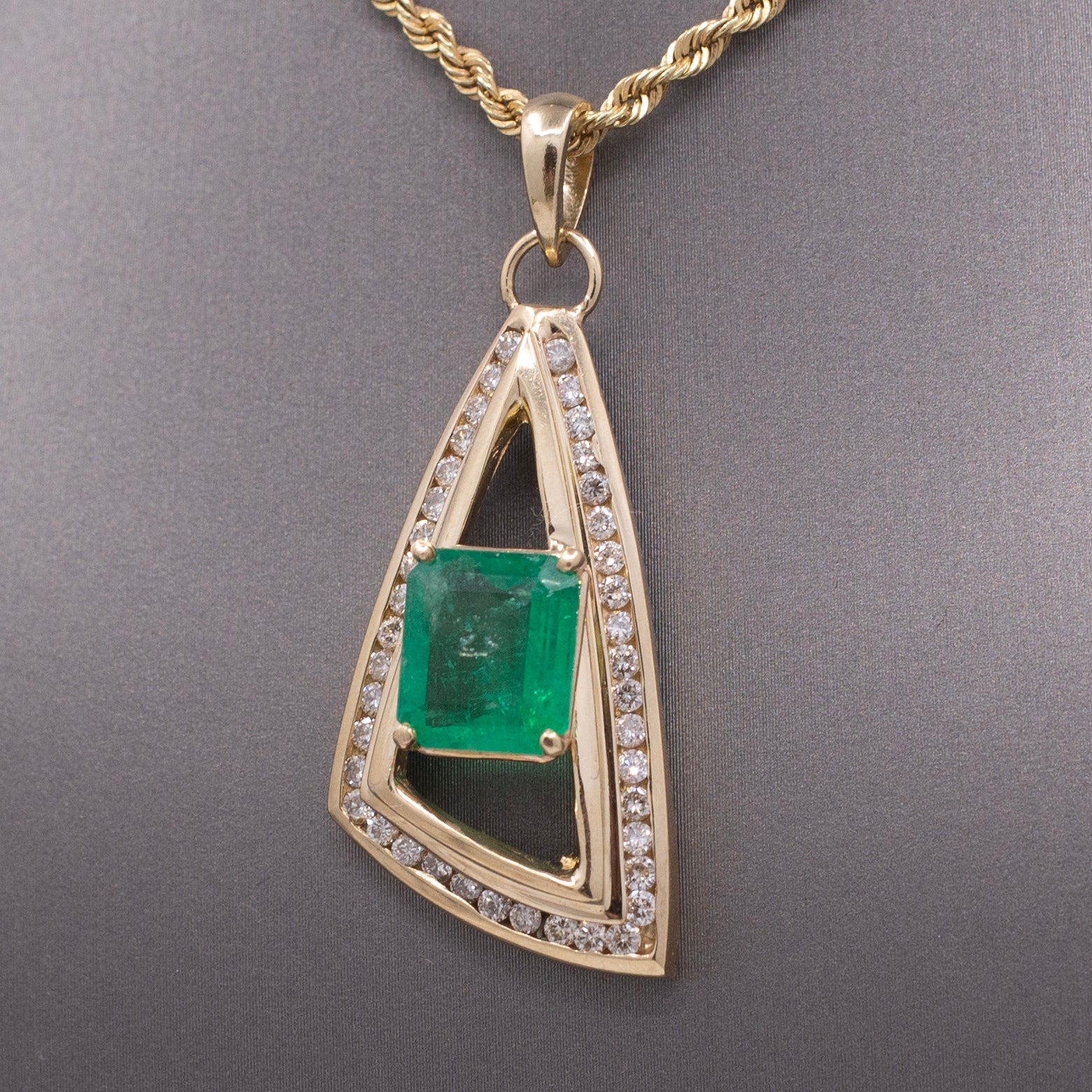 Modernist Natural Emerald and Channel Set Diamond Pendant in 14k Yellow Gold
