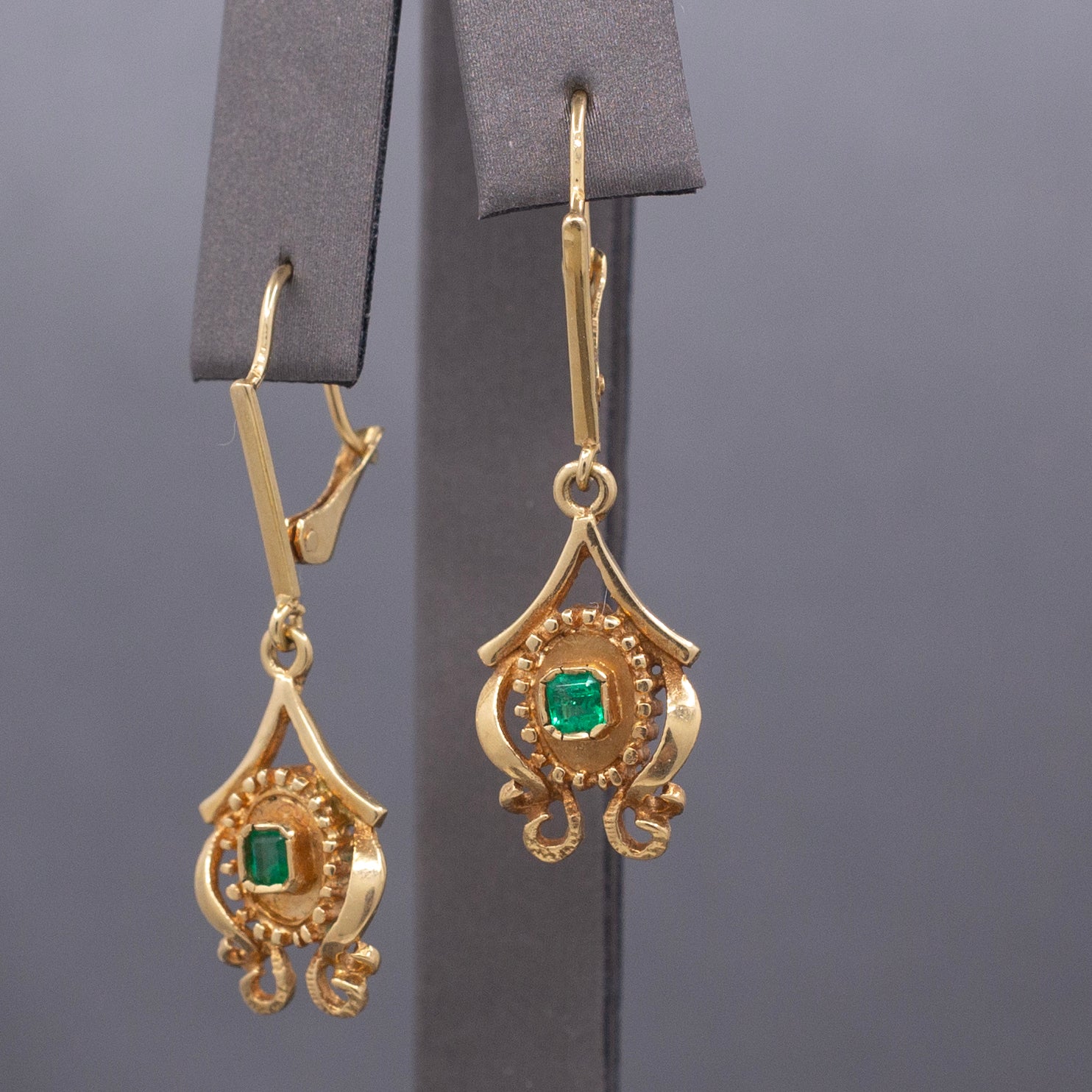 Feminine Bezel Set Emerald Dangle Drop Earrings in 18k Yellow Gold