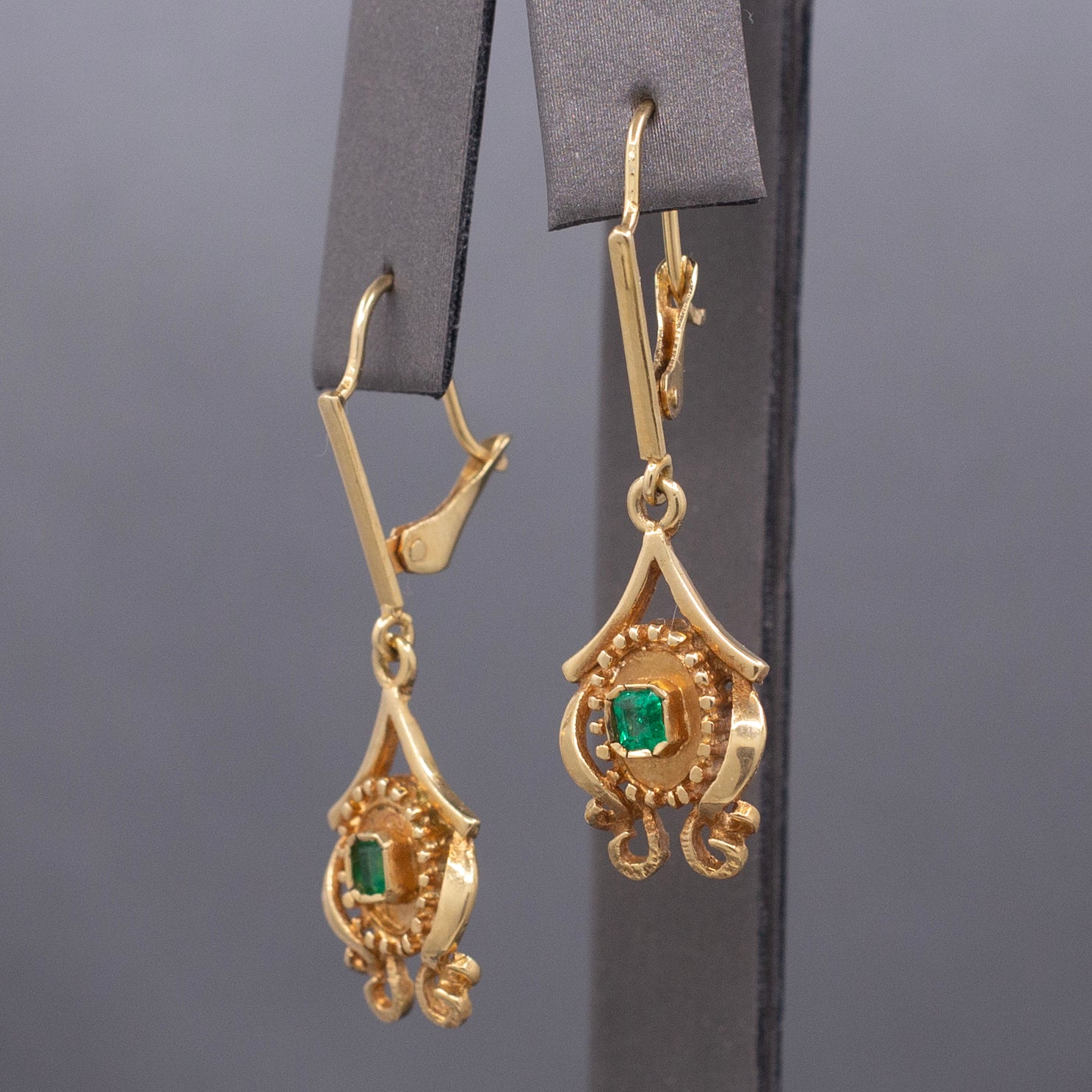 Feminine Bezel Set Emerald Dangle Drop Earrings in 18k Yellow Gold