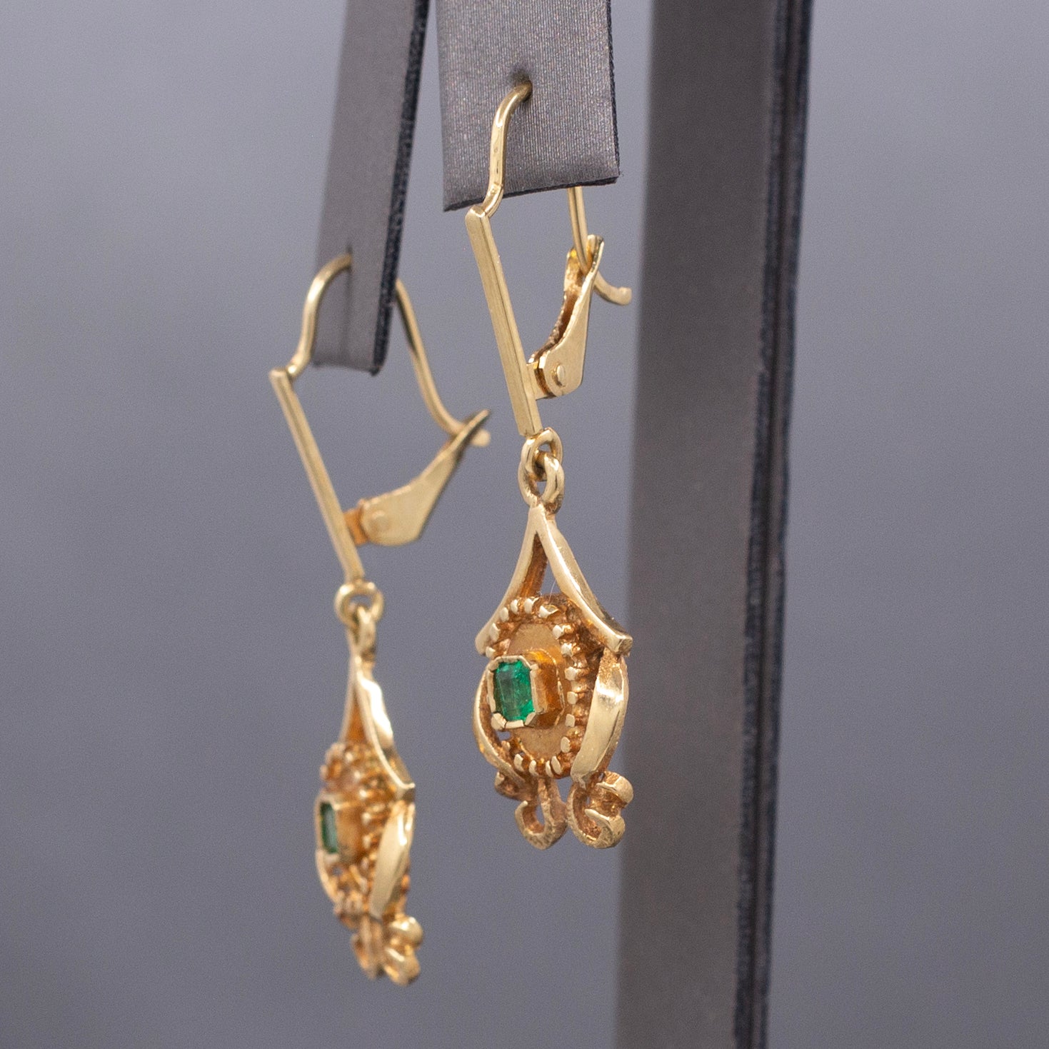 Feminine Bezel Set Emerald Dangle Drop Earrings in 18k Yellow Gold
