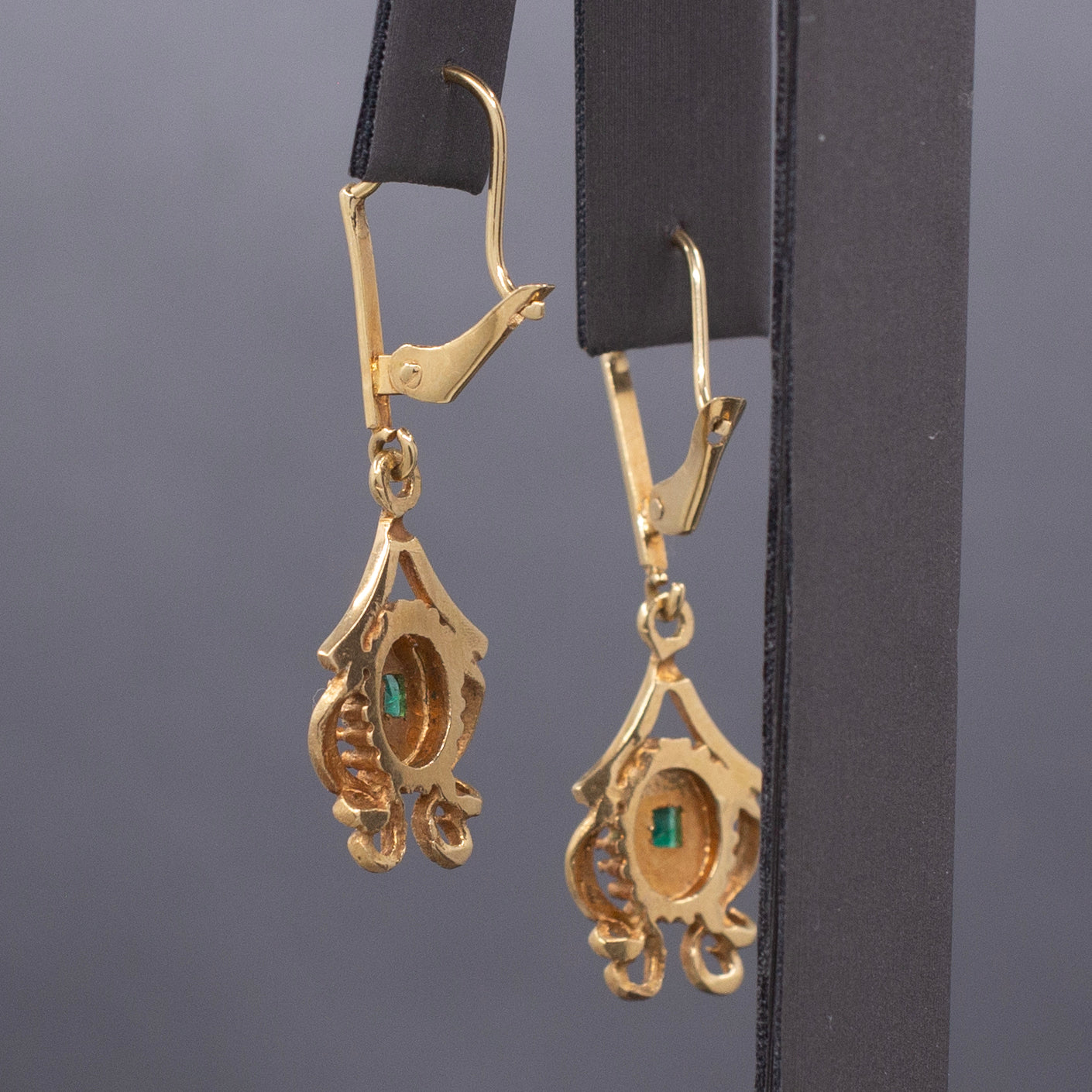 Feminine Bezel Set Emerald Dangle Drop Earrings in 18k Yellow Gold