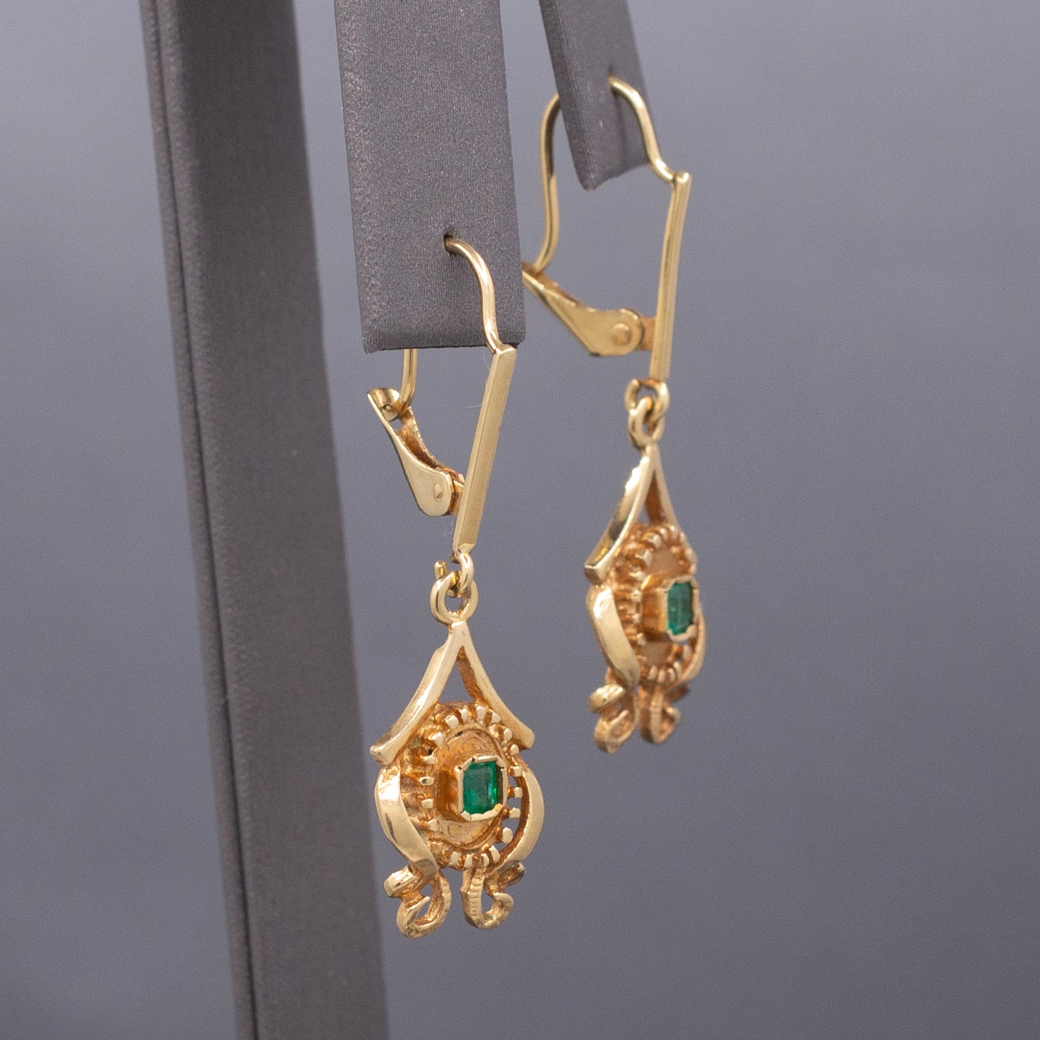 Feminine Bezel Set Emerald Dangle Drop Earrings in 18k Yellow Gold