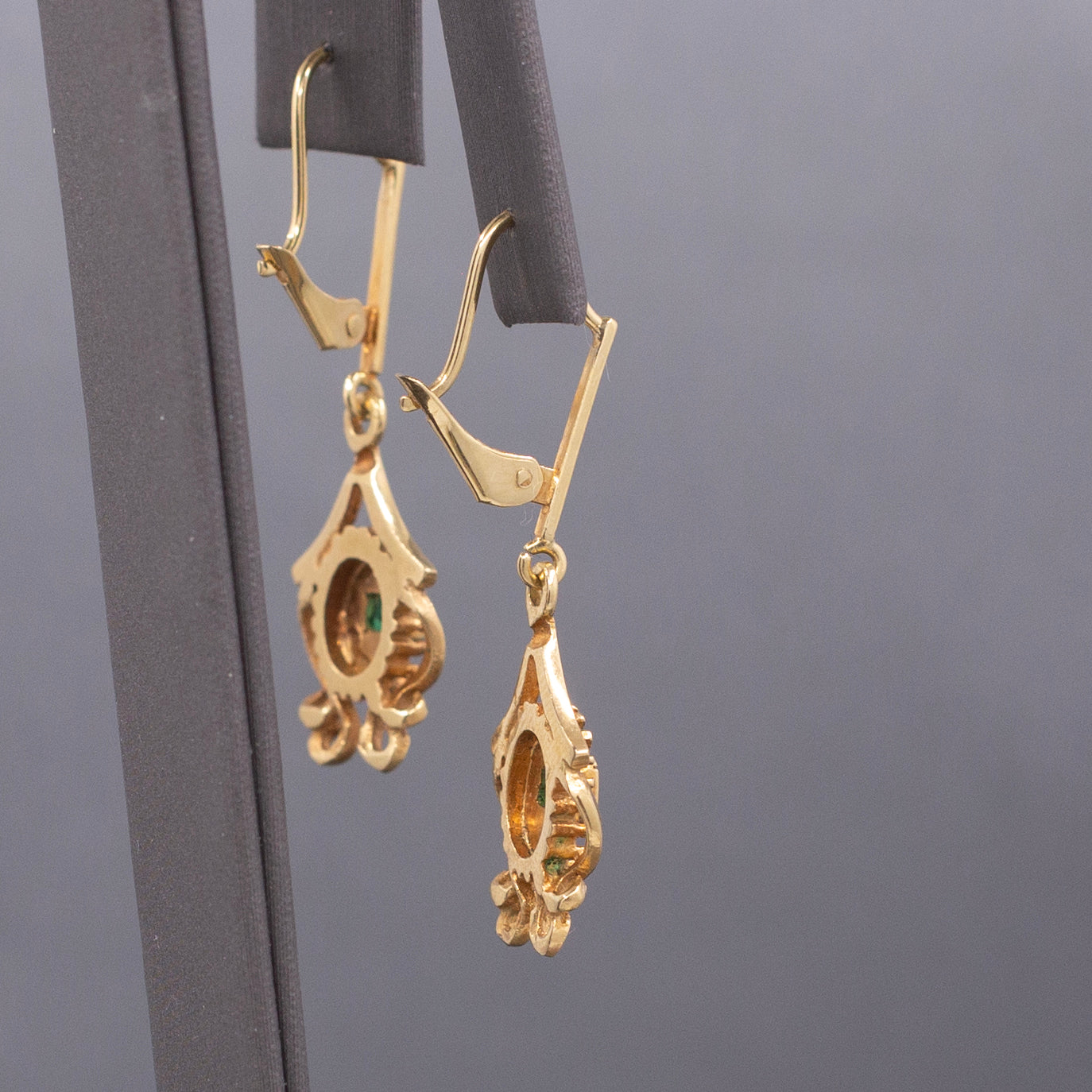 Feminine Bezel Set Emerald Dangle Drop Earrings in 18k Yellow Gold