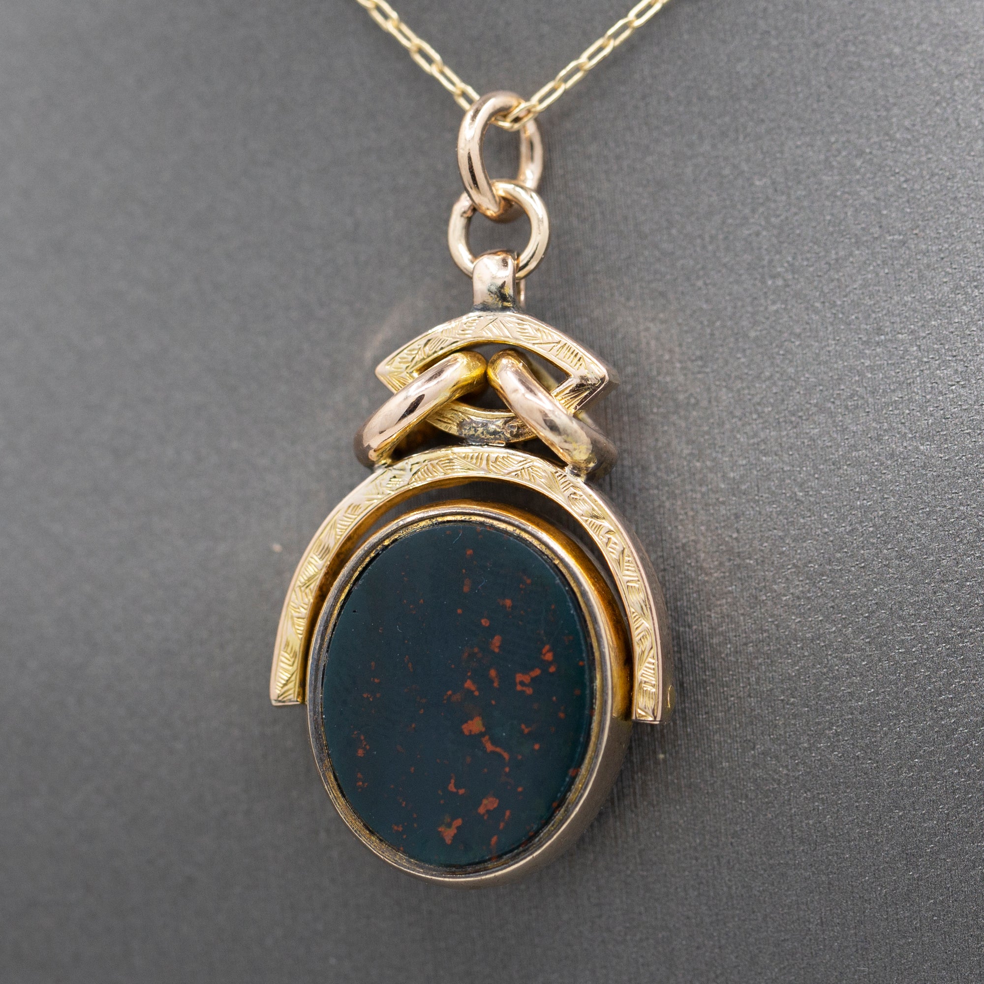 Antique Victorian Spinning Oval Bloodstone and Onyx Fob Pendant in 10k Yellow Gold