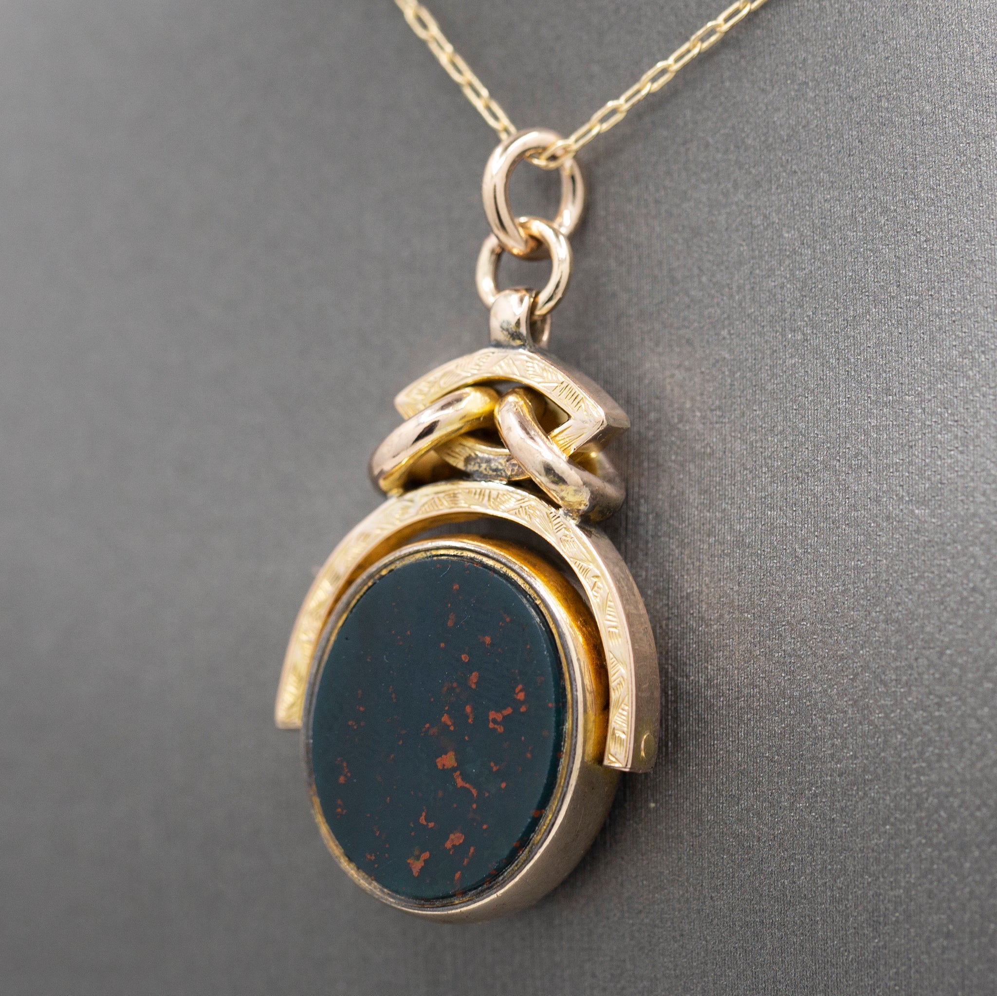 Antique Victorian Spinning Oval Bloodstone and Onyx Fob Pendant in 10k Yellow Gold