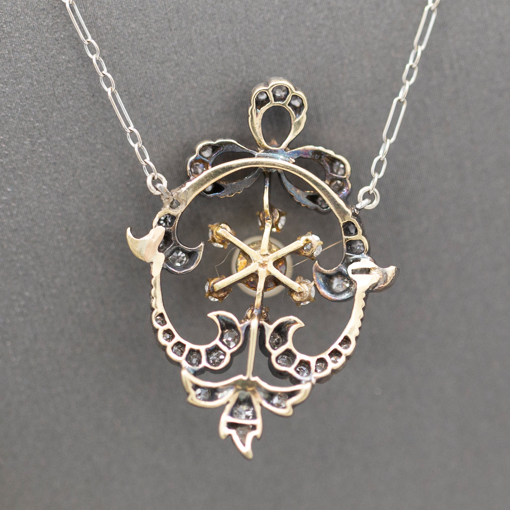Exquisite Edwardian Natural Pearl and Diamond Bow Necklace in 14k White and Yellow Gold