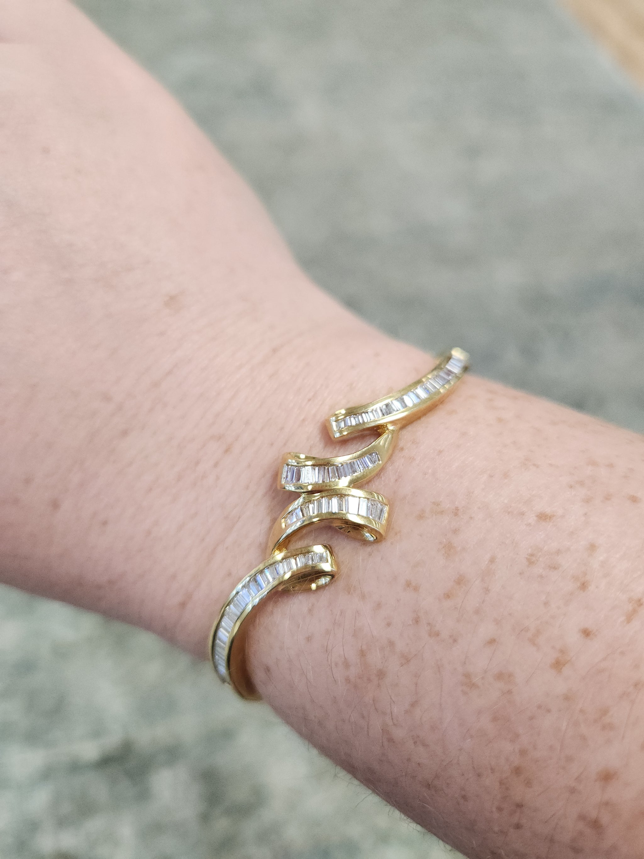 Elegant Baguette Cut Diamond Channel Set Hinged Bangle Bracelet in 18k Yellow Gold