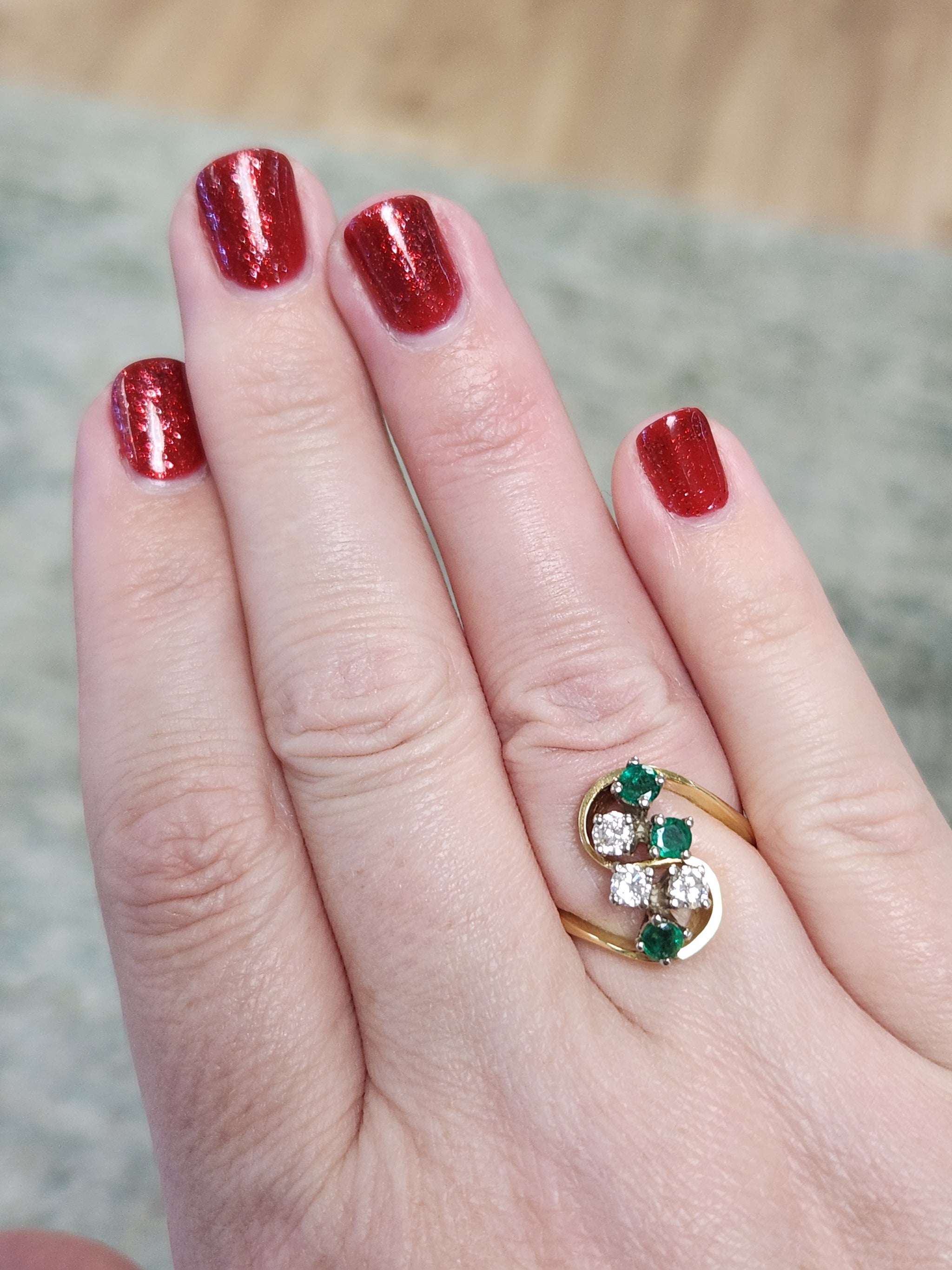 Elegant Emerald and Diamond Cluster Bypass Swirl Ring in 18k Yellow Gold