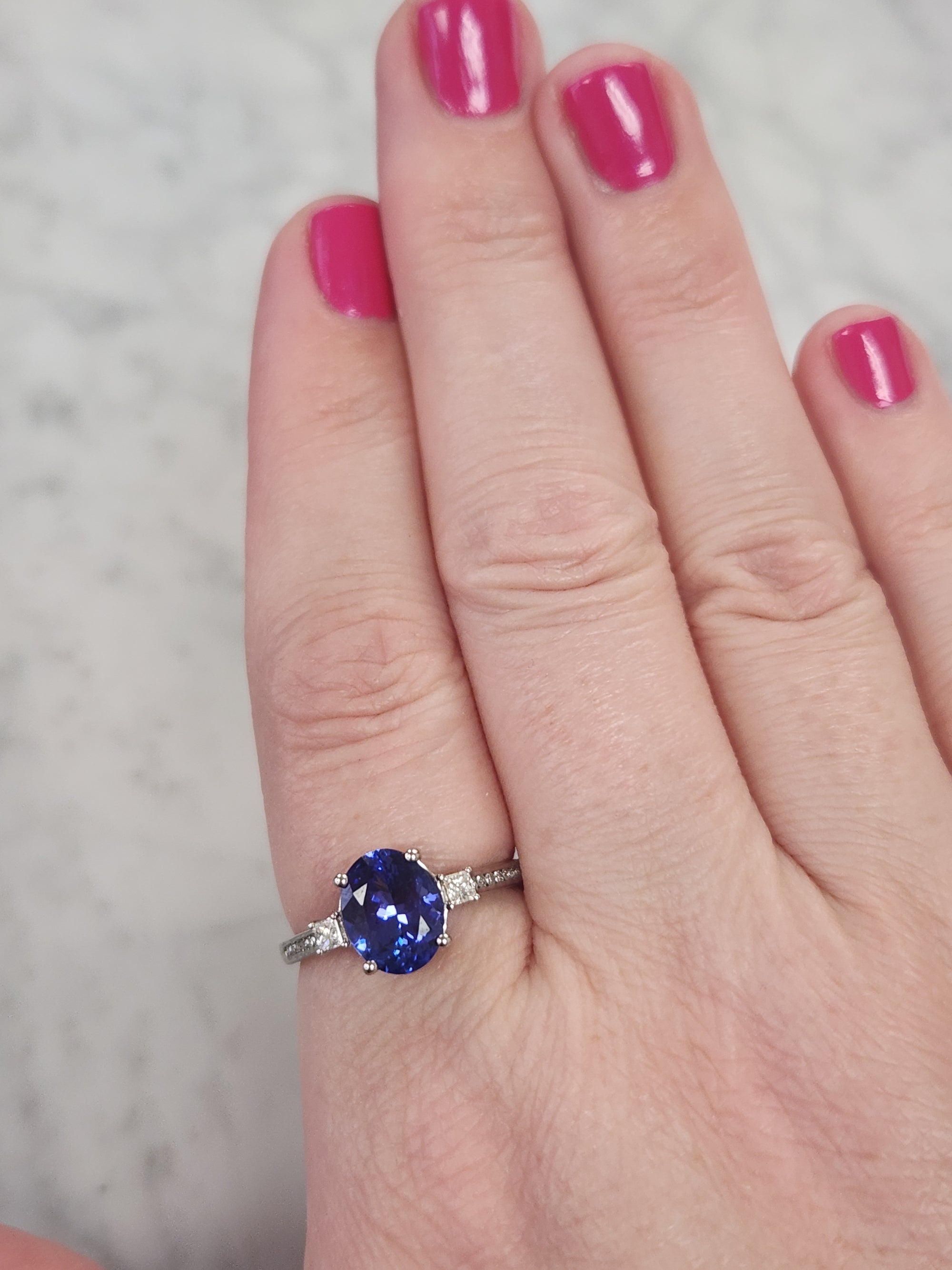 Vivid Oval Cut Tanzanite and Diamond Ring in Platinum