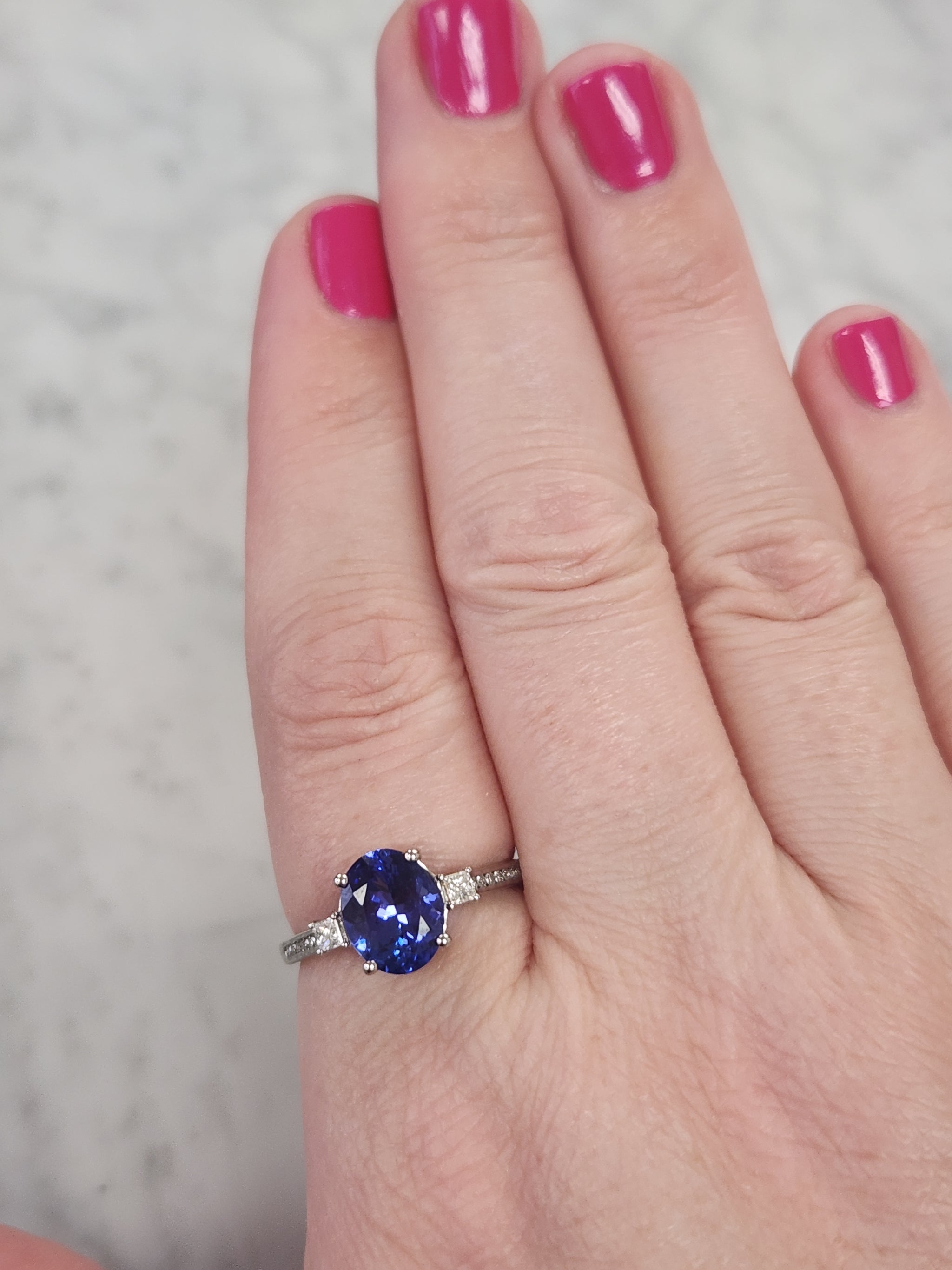 Vivid Oval Cut Tanzanite and Diamond Ring in Platinum