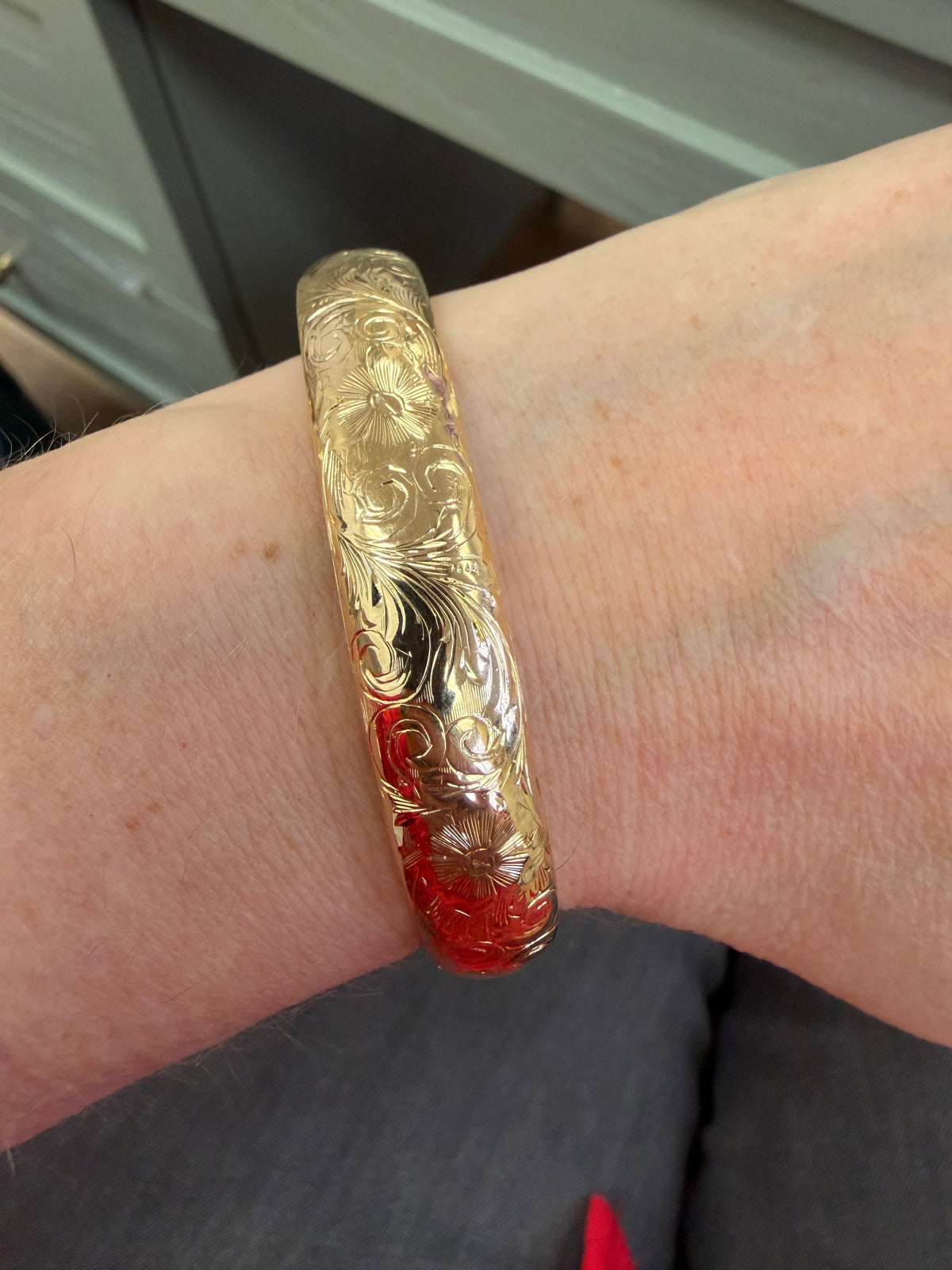 Floral Engraved Domed Oval Hinged Bangle in 14k Yellow Gold