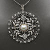 Late Art Deco Pearl and Diamond Medallion Pendant in Platinum