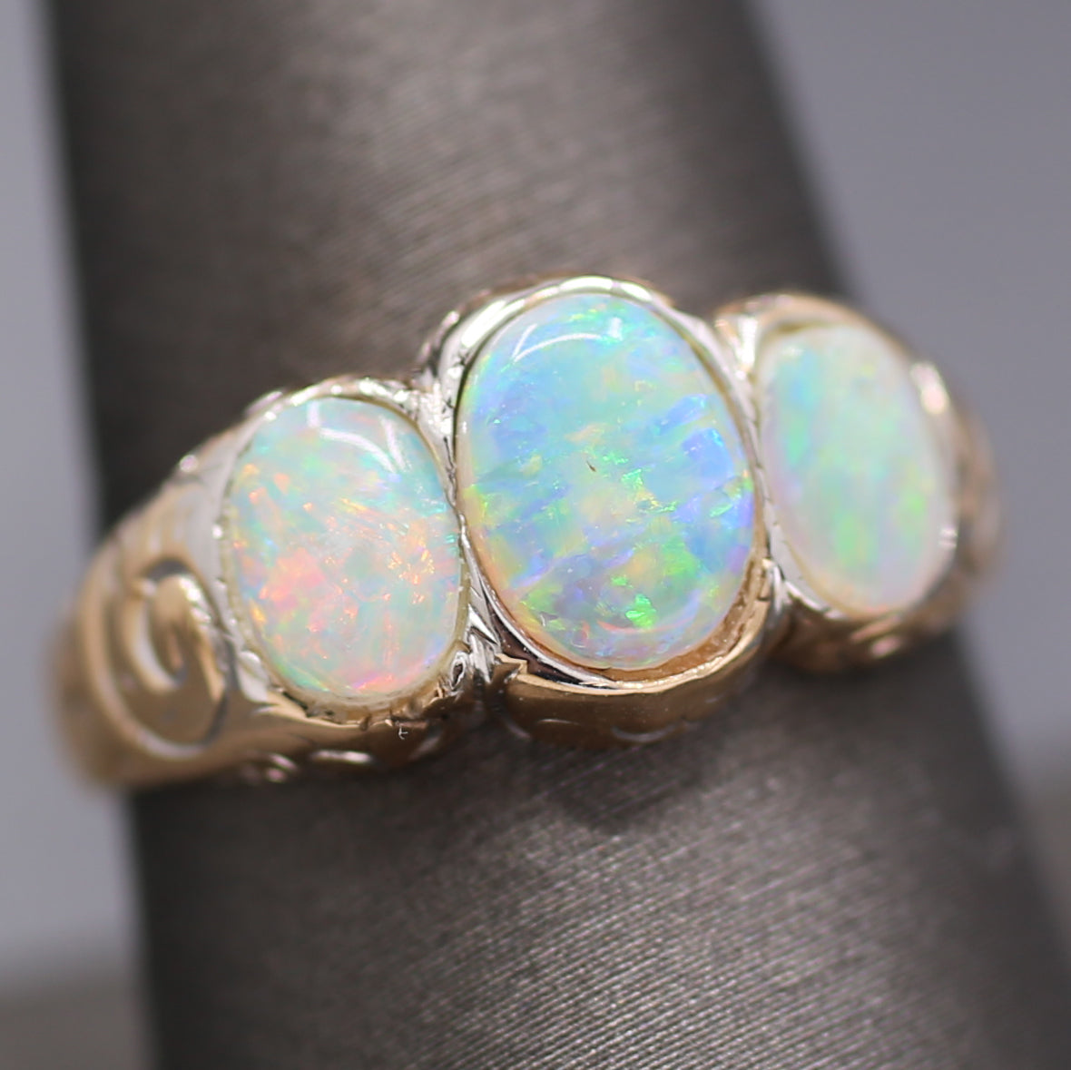 Late Victorian Bezel Set Opal Three Stone Engraved Band Ring in 14k Yellow Gold