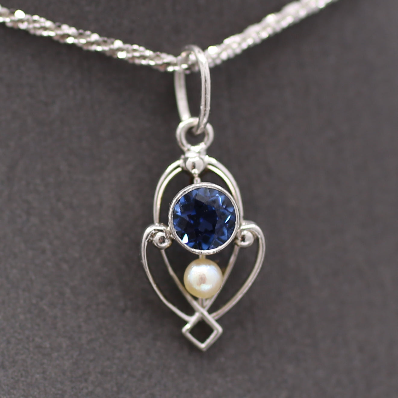 Petite Edwardian Yogo Montana Sapphire and Seed Pearl Pendant Charm in Platinum