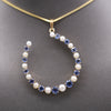 Victorian Yogo Montana Blue Sapphire and Pearl Horseshoe Good Luck Pendant in 14k