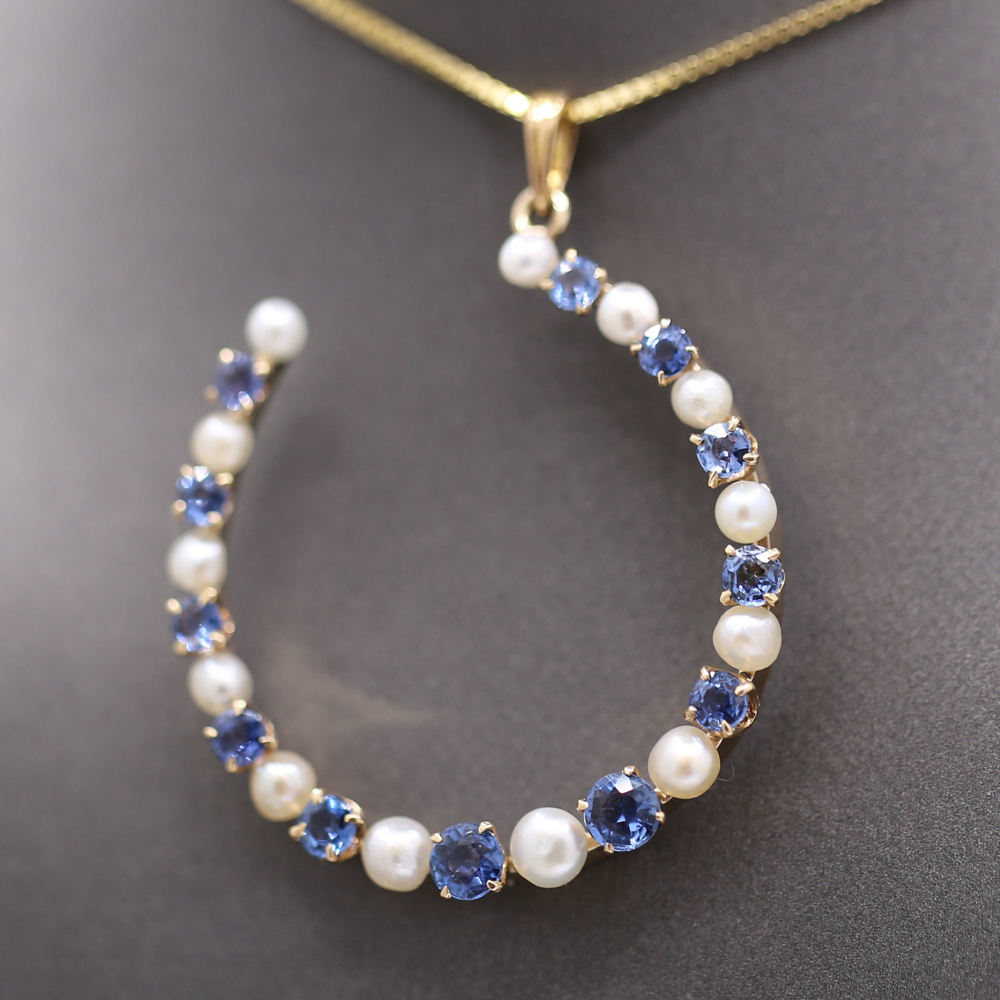 Victorian Yogo Montana Blue Sapphire and Pearl Horseshoe Good Luck Pendant in 14k