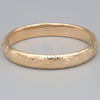 Floral Engraved Domed Oval Hinged Bangle in 14k Yellow Gold