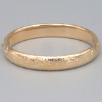 Floral Engraved Domed Oval Hinged Bangle in 14k Yellow Gold