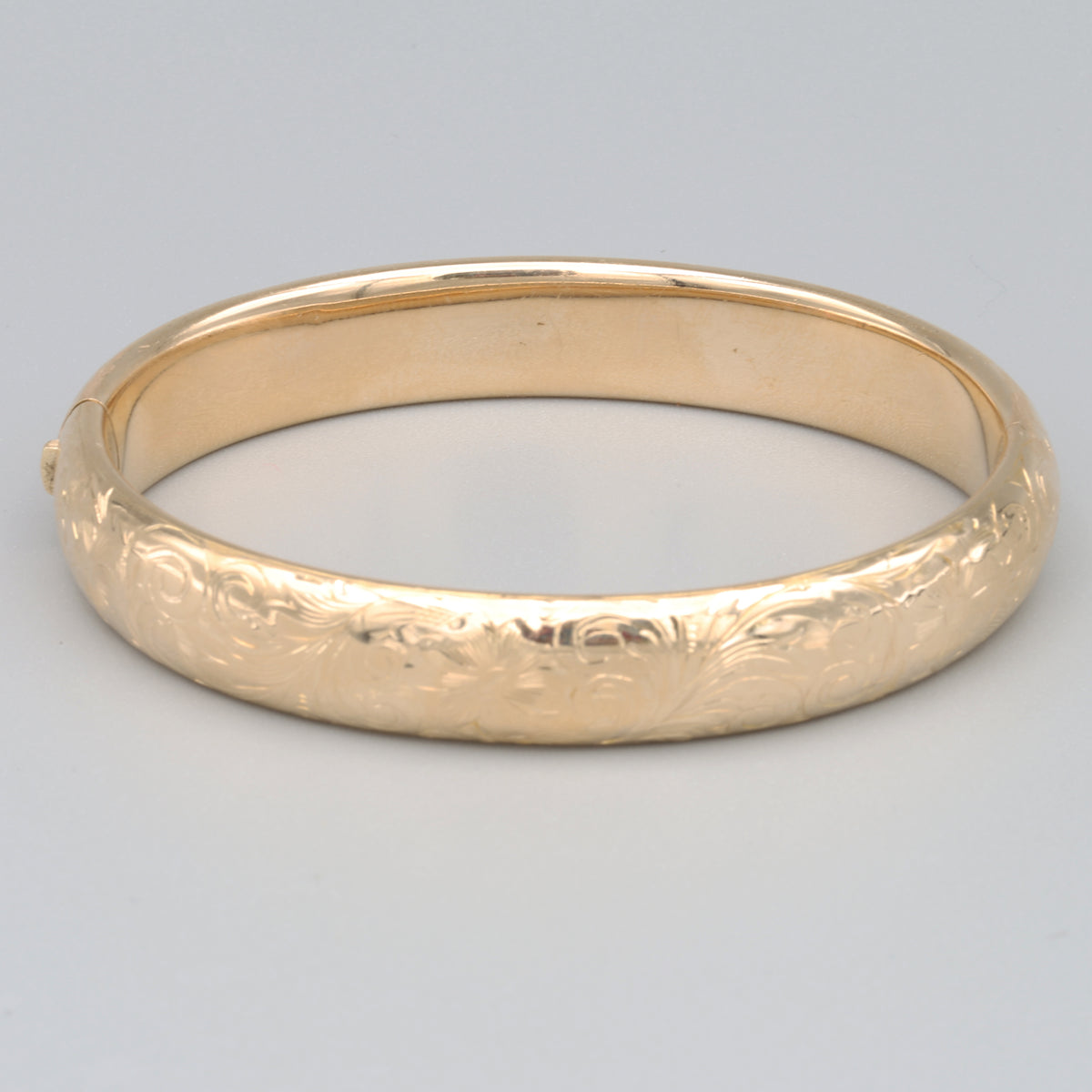 Floral Engraved Domed Oval Hinged Bangle in 14k Yellow Gold