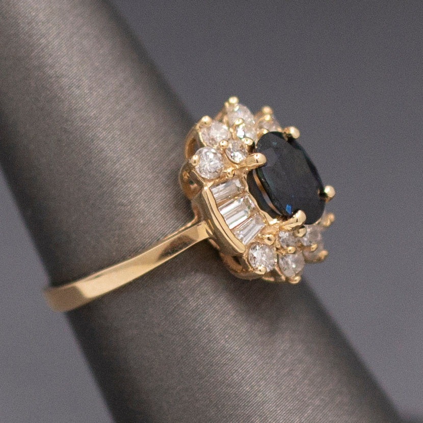 Midnight Blue Sapphire with Round and Baguette Cut Diamonds Ring in 14k Yellow Gold