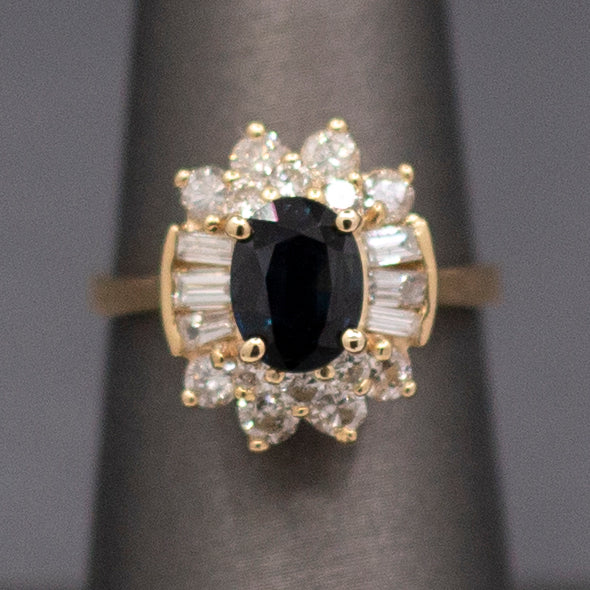 Midnight Blue Sapphire with Round and Baguette Cut Diamonds Ring in 14k Yellow Gold