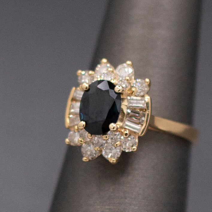Midnight Blue Sapphire with Round and Baguette Cut Diamonds Ring in 14k Yellow Gold