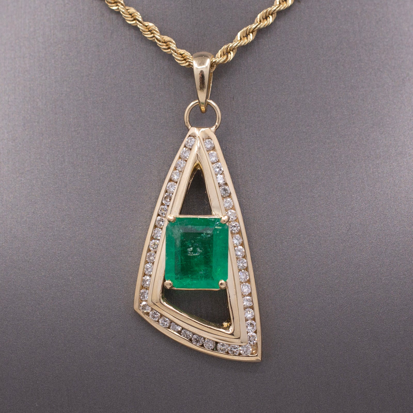 Modernist Natural Emerald and Channel Set Diamond Pendant in 14k Yellow Gold