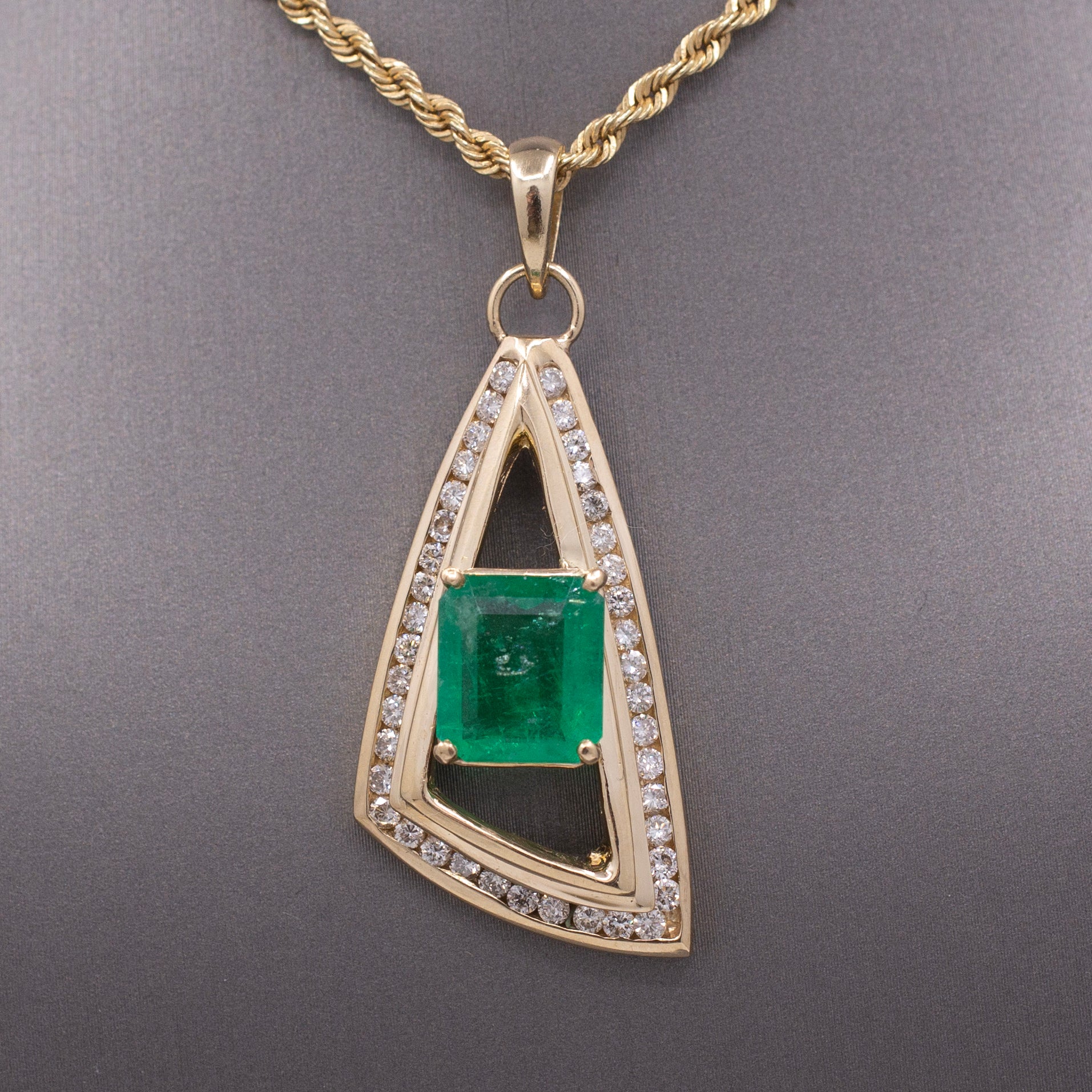 Modernist Natural Emerald and Channel Set Diamond Pendant in 14k Yellow Gold