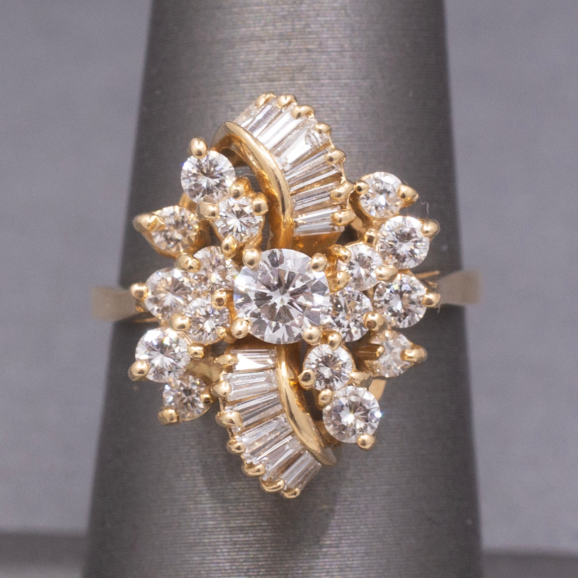 Sparkling Round and Baguette Cut Diamond Ribbon Ring in 14k Yellow Gold