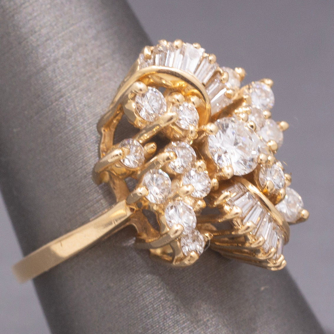 Sparkling Round and Baguette Cut Diamond Ribbon Ring in 14k Yellow Gold