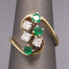 Elegant Emerald and Diamond Cluster Bypass Swirl Ring in 18k Yellow Gold