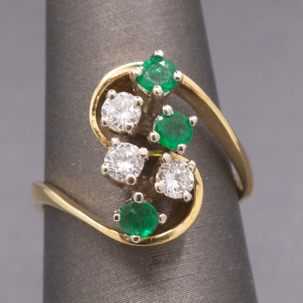 Elegant Emerald and Diamond Cluster Bypass Swirl Ring in 18k Yellow Gold