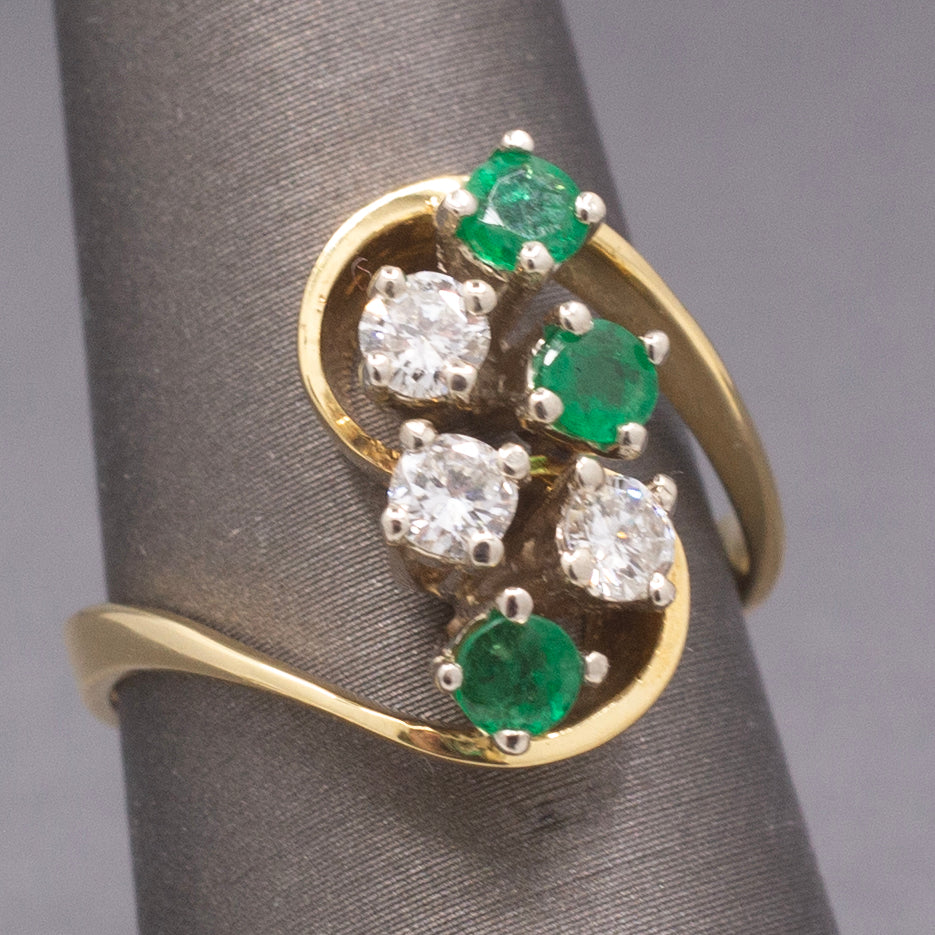 Elegant Emerald and Diamond Cluster Bypass Swirl Ring in 18k Yellow Gold