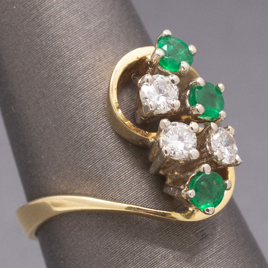 Elegant Emerald and Diamond Cluster Bypass Swirl Ring in 18k Yellow Gold