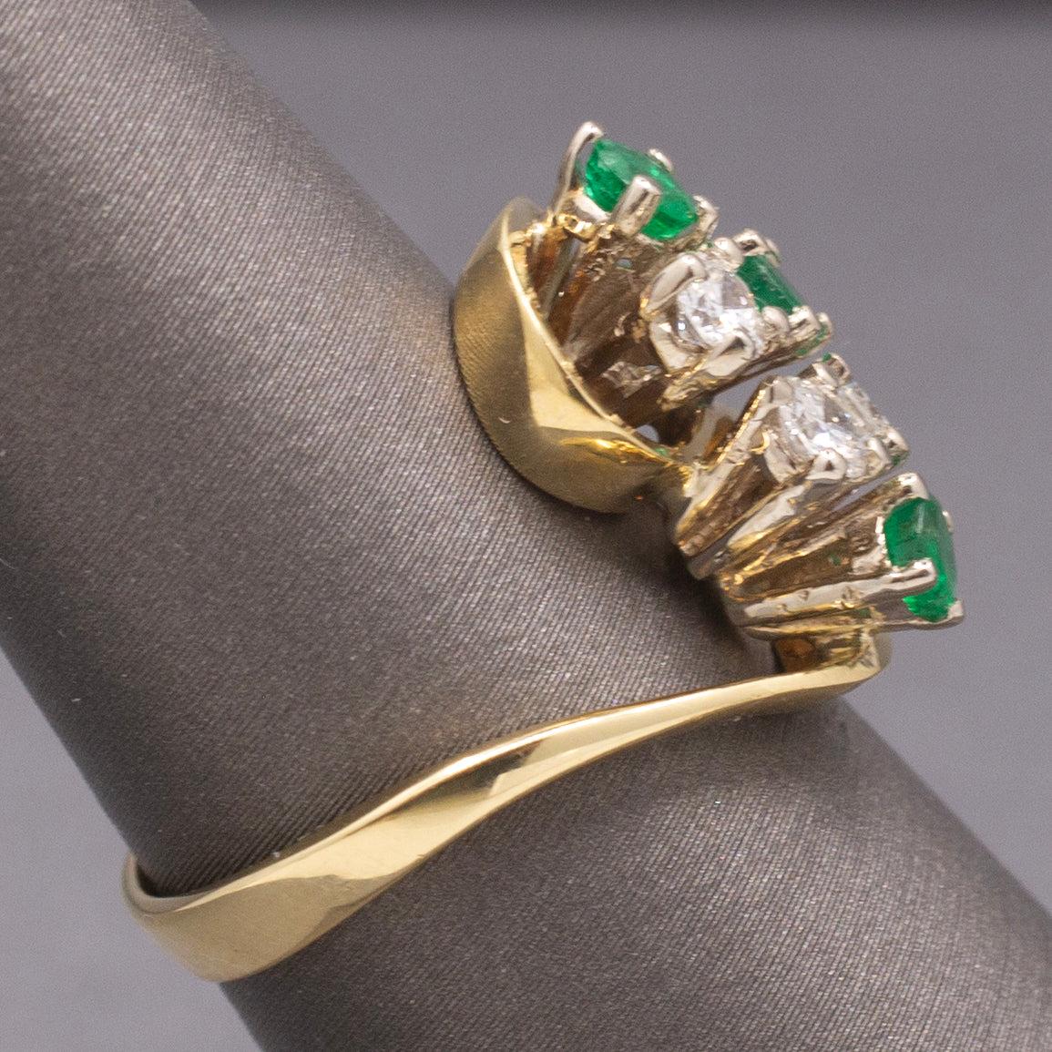 Elegant Emerald and Diamond Cluster Bypass Swirl Ring in 18k Yellow Gold