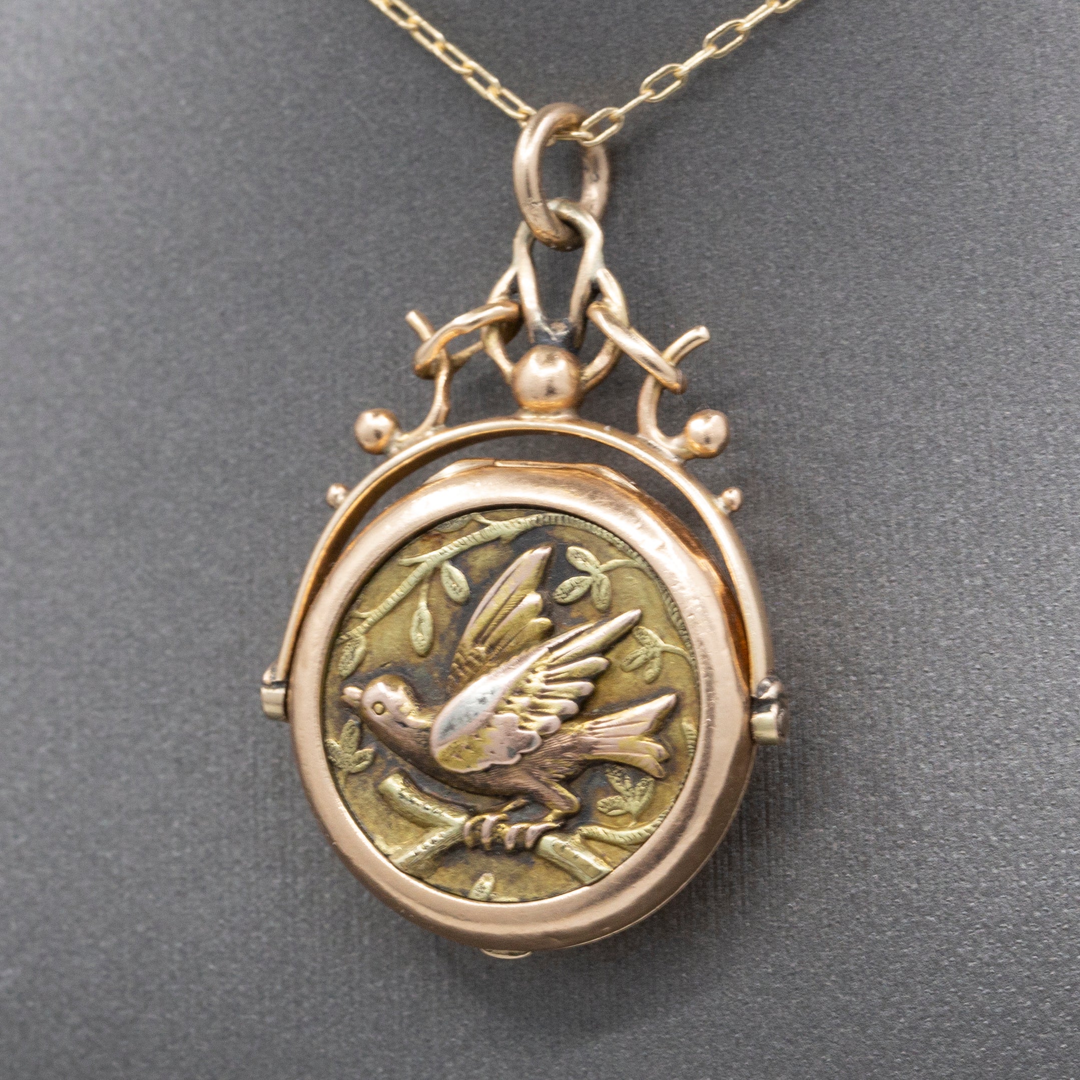 Antique Victorian Spinning Bird Onyx Locket in 14k Rose Gold
