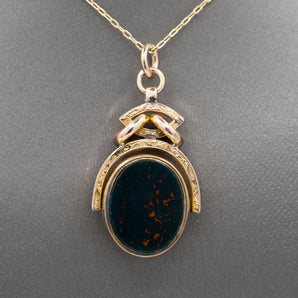 Antique Victorian Spinning Oval Bloodstone and Onyx Fob Pendant in 10k Yellow Gold