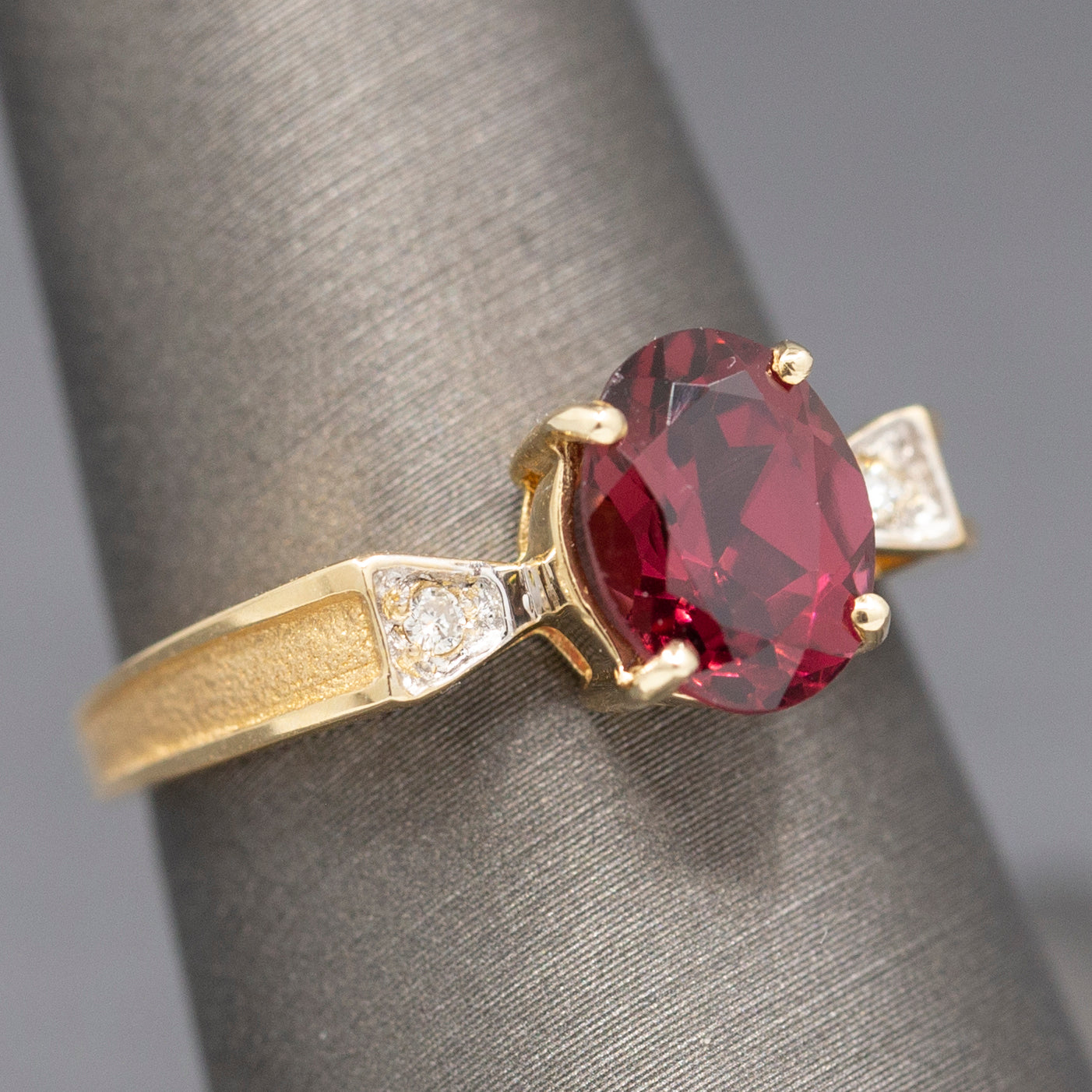 Ravishing Rhodolite Garnet and Diamond Accent Bow Ring in 14k Yellow Gold