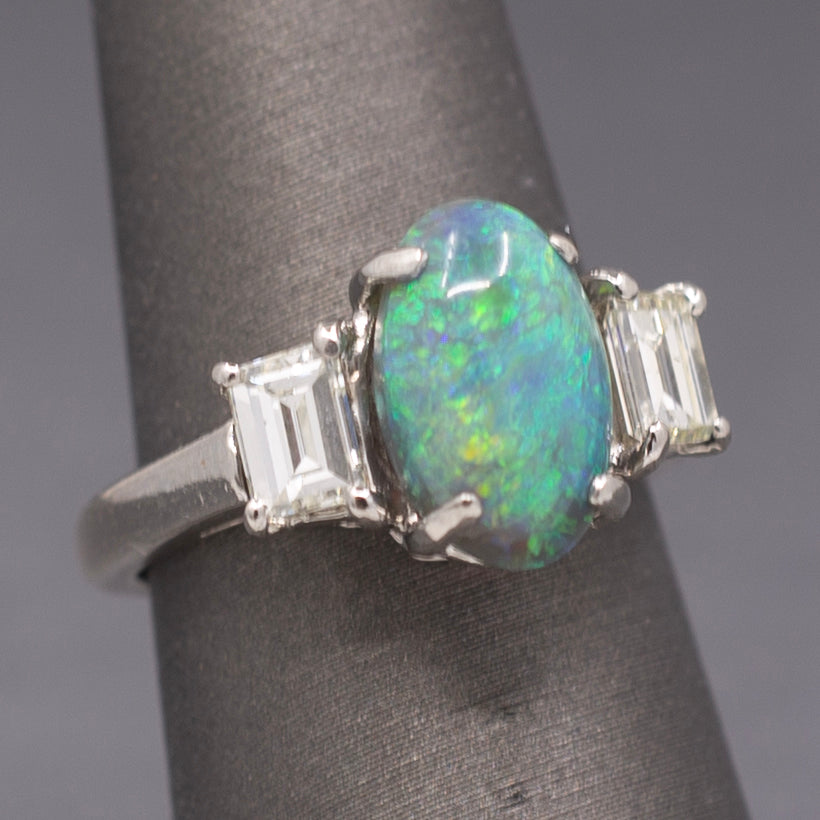 Exquisite Black Opal and Trapezoid Cut Diamond Three Stone Ring in Platinum