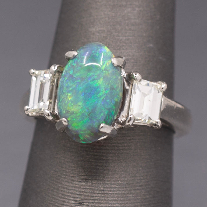Exquisite Black Opal and Trapezoid Cut Diamond Three Stone Ring in Platinum
