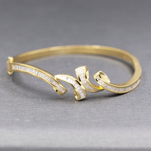 Elegant Baguette Cut Diamond Channel Set Hinged Bangle Bracelet in 18k Yellow Gold