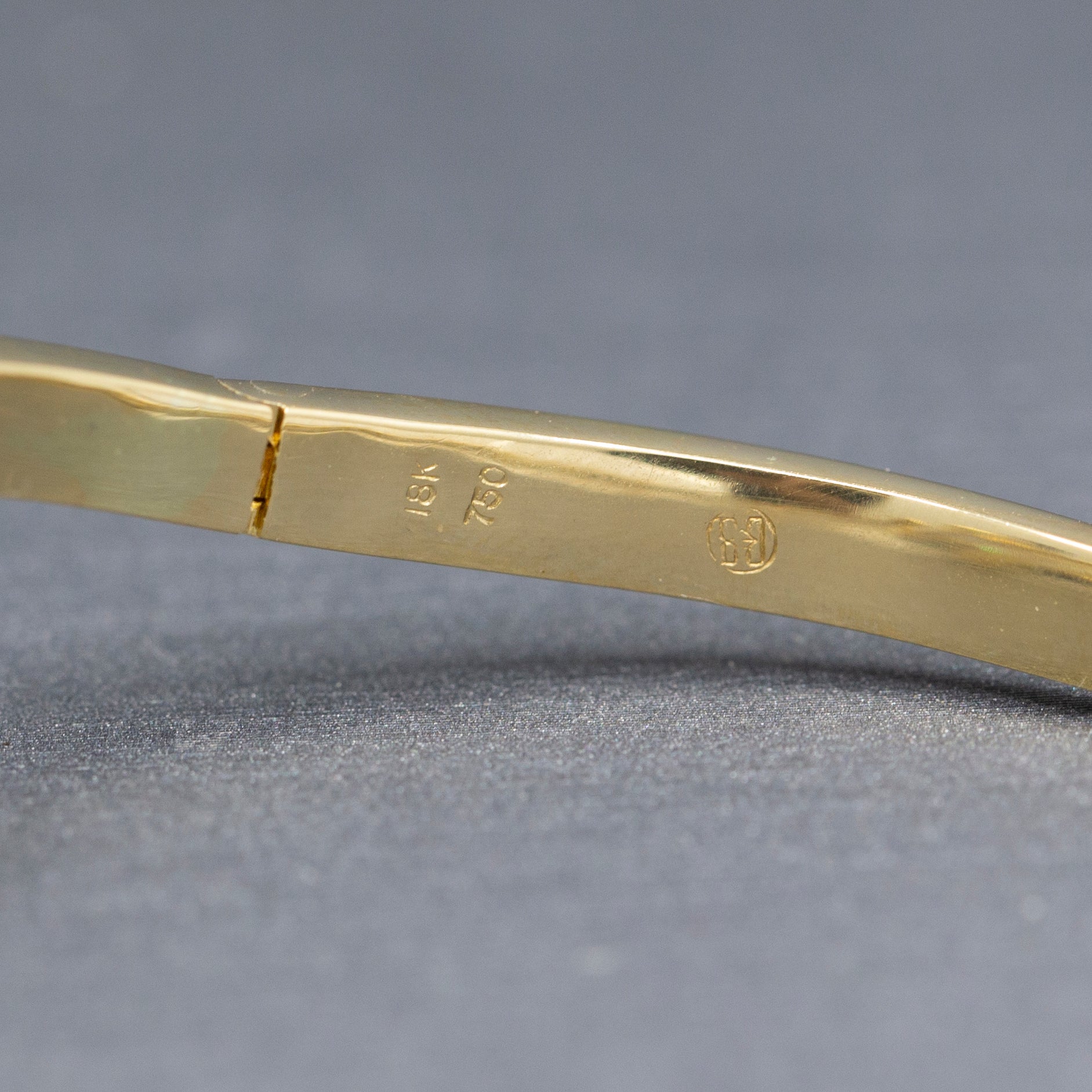 Elegant Baguette Cut Diamond Channel Set Hinged Bangle Bracelet in 18k Yellow Gold