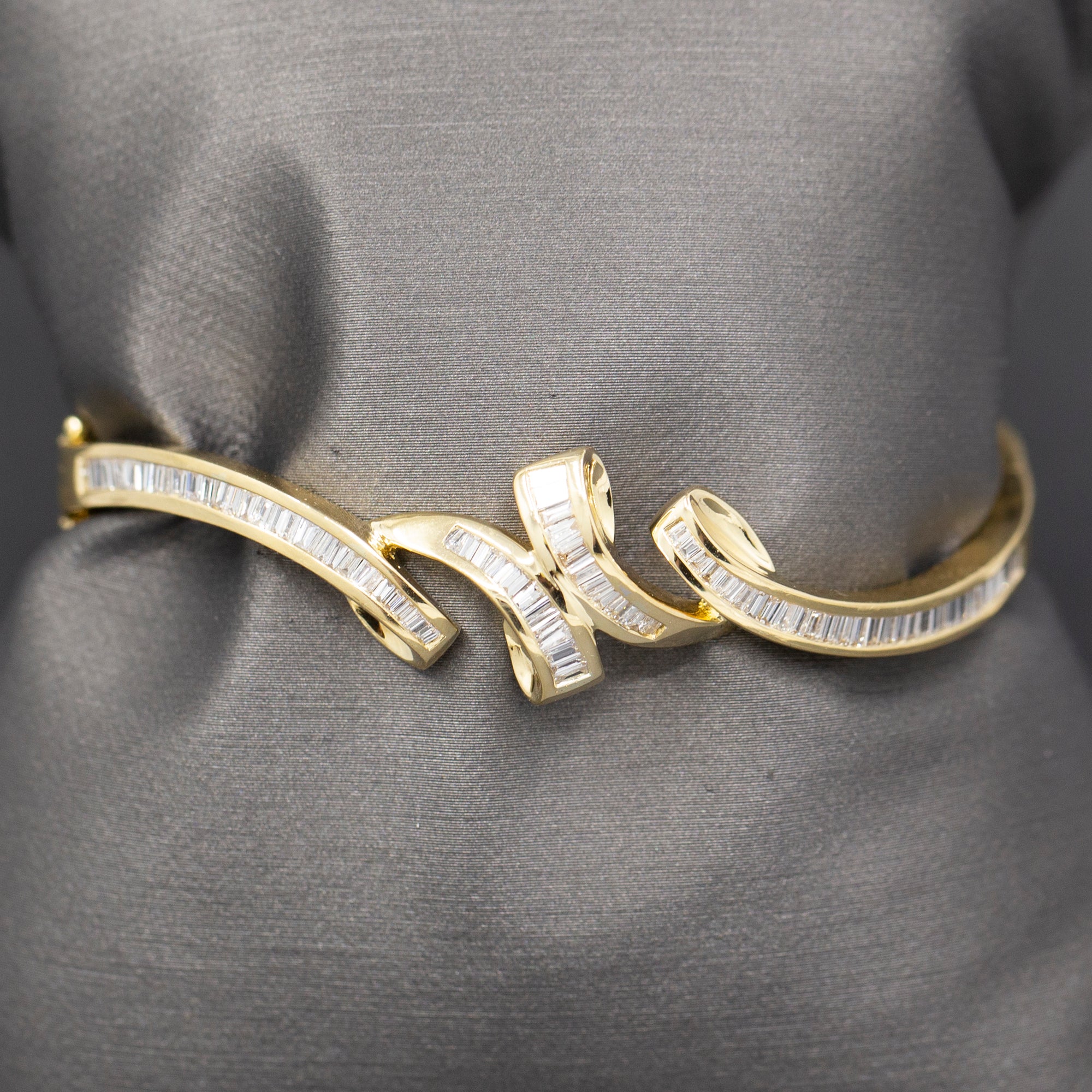 Elegant Baguette Cut Diamond Channel Set Hinged Bangle Bracelet in 18k Yellow Gold