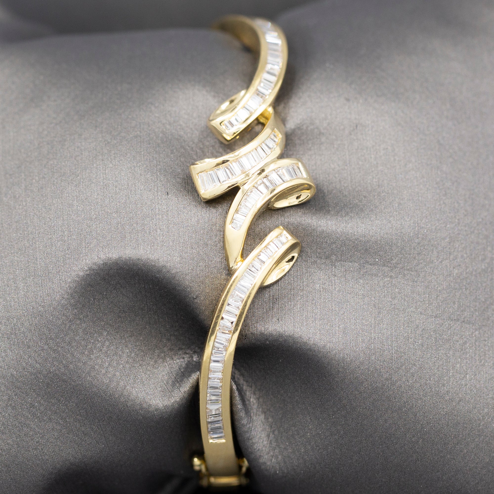 Elegant Baguette Cut Diamond Channel Set Hinged Bangle Bracelet in 18k Yellow Gold